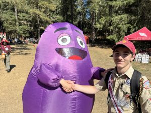 grimace shaking hands